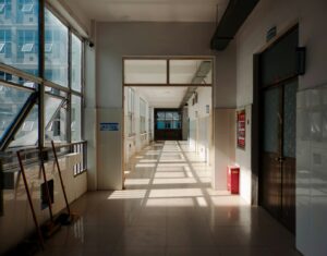 Long hallway with sunlight creating shadows
